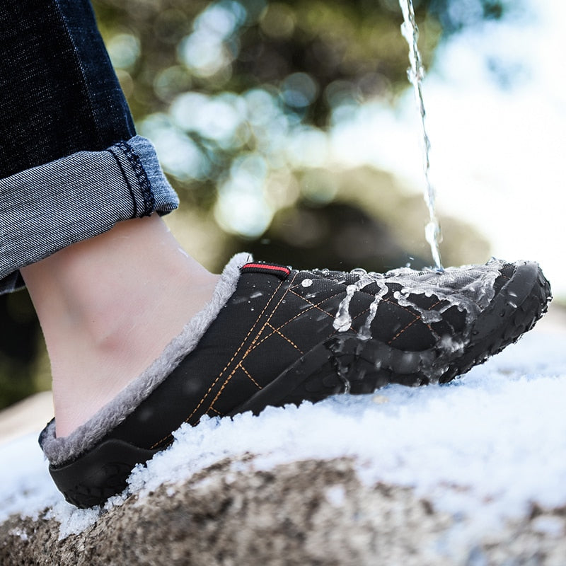 Warm and stylish, these men's slippers are perfect for winter days. The cozy lining keeps feet dry and comfortable, and the rubbery soles provide a sure footing for any day. The lightweight design adds style and comfort to any casual outfit. This pair is crafted from durable canvas material with a plushily cushioned insole. A secure constricting band around the ankle keeps the slippers securely in place. This pair is a fun and comfortable way to keep warm and stylish.