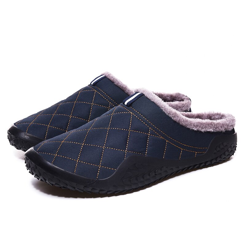 Warm and stylish, these men's slippers are perfect for winter days. The cozy lining keeps feet dry and comfortable, and the rubbery soles provide a sure footing for any day. The lightweight design adds style and comfort to any casual outfit. This pair is crafted from durable canvas material with a plushily cushioned insole. A secure constricting band around the ankle keeps the slippers securely in place. This pair is a fun and comfortable way to keep warm and stylish.