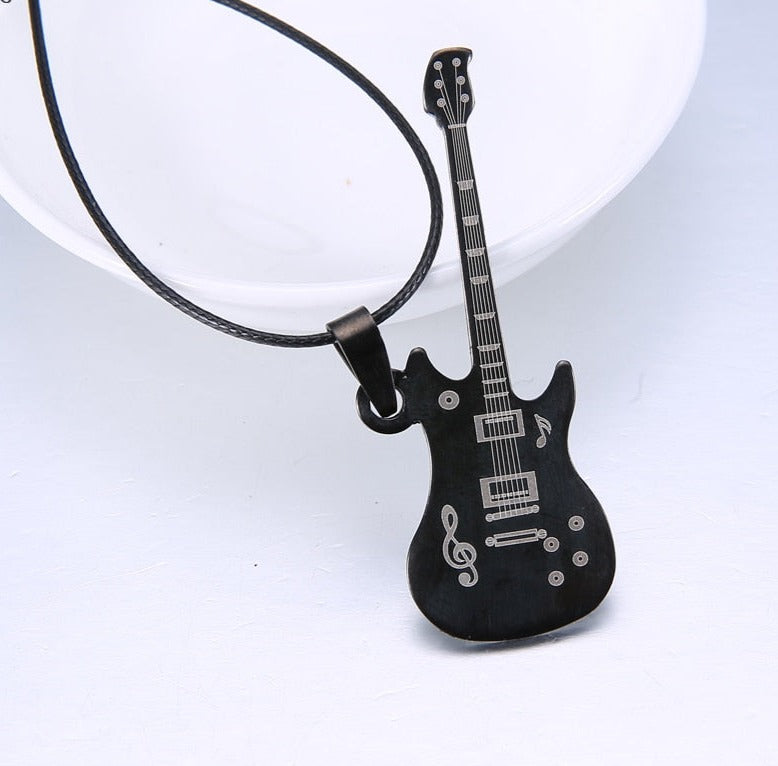 The perfect accessory for any music fan. This stainless steel guitar necklace is the perfect way to show off your musical obsession. This stainless steel guitar pendant is a sleek and stylish piece that can be worn casually or formally. This unique design is sure to turn heads. The chain is made from a soft leather that feels great against the skin. The chain is flexible so it can be worn around the neck or draped across the chest. This is a great gift for rock and roll fans and music lovers.