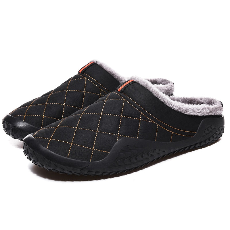 Warm and stylish, these men's slippers are perfect for winter days. The cozy lining keeps feet dry and comfortable, and the rubbery soles provide a sure footing for any day. The lightweight design adds style and comfort to any casual outfit. This pair is crafted from durable canvas material with a plushily cushioned insole. A secure constricting band around the ankle keeps the slippers securely in place. This pair is a fun and comfortable way to keep warm and stylish.